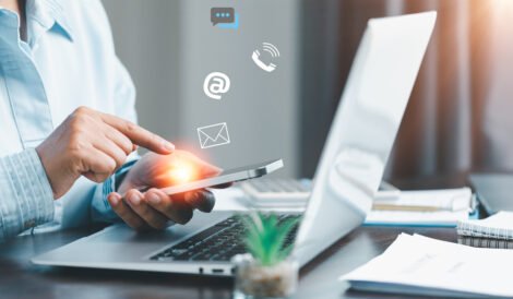 businesswoman using phone touching virtual screen contact icons such as email address live chat internet wifi contact us customer support hotline people connect connect with cyberspace